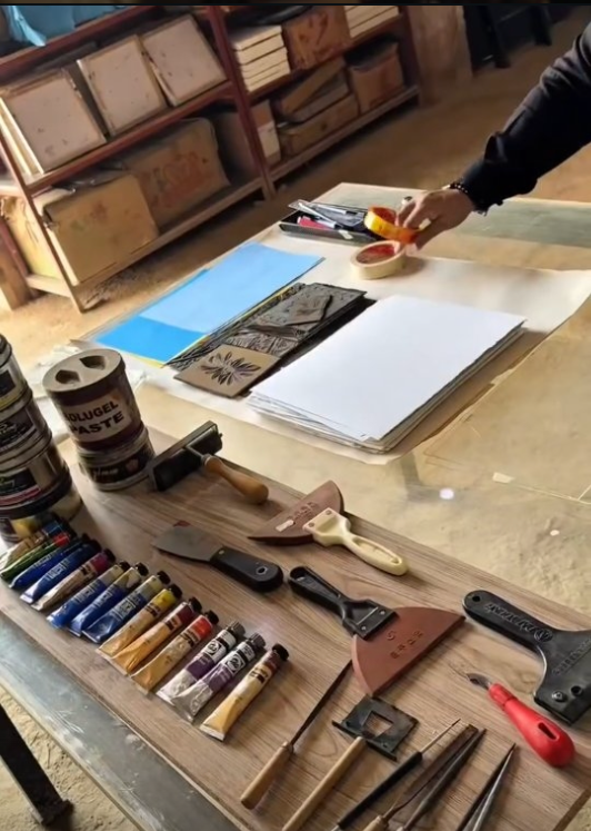 Tools and inks laid out before a print run